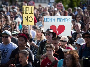 People listen during a protest against the Kinder Morgan Trans Mountain Pipeline expansion, in Vancouver, on Tuesday May 29, 2018. The federal Liberal government is spending $4.5 billion to buy Trans Mountain and all of Kinder Morgan Canada's core assets.