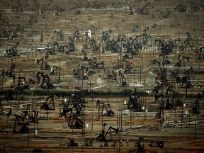 A general view shows oil pumping jacks and drilling pads at the Kern River Oil Field where the principle operator is the Chevron Corporation in Bakersfield, California.