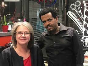 Suzanne Phillips and Adish Gebreselase at Splitt Ends Unisex Hair Design, a storefront salon in Halifax that Phillips sold to the Eritrean immigrant last year.