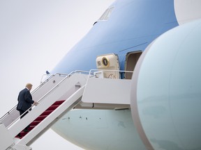 U.S. President Donald Trump boards Air Force One at Joint Base Andrews, Md., on his way to Texas for Republican fundraisers.