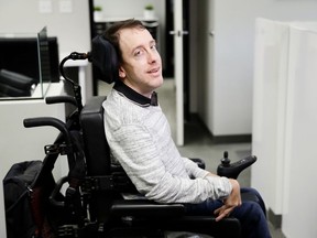 In this May 18, 2018, photo, Miles Thornback, who has cerebral palsy, poses for a photo at RE/MAX Prestige real estate office where he works in Costa Mesa, Calif. Thornback got hired three years ago at the real estate agency after the owners heard that he'd spent six years applying for jobs at hundreds of companies and finding nothing but negative mindsets. Many small business owners are open to hiring or want to recruit employees who have disabilities. Sometimes it's because they want to create opportunities for people who have talent and skills but can't find jobs.