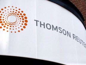 A Thomson Reuters office sign is shown in Boston, Thursday August 6, 2009. Thomson Reuters Corp. reported a loss in its first quarter as it took a one-time charge related to the sale of its financial and risk business announced earlier this year. The company, which keeps its books in U.S. dollars, said the loss attributable to shareholders amounted to US$339 million or 48 cents per share compared with a profit attributable to shareholders of $297 million or 41 cents per share a year ago.