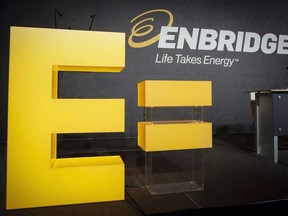 Enbridge company logos on display at the company's annual meeting in Calgary, Thursday, May 12, 2016. Enbridge Inc. is proposing a series of transactions with its co-investors in four affiliated businesses, who are being offered company shares worth a total of about $11.4 billion based on current stock prices.