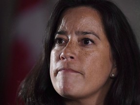Minister of Justice and Attorney General of Canada Jody Wilson-Raybould listens to a question as she speaks to reporters following Question Period in the Foyer of the House of Commons on Parliament Hill in Ottawa on Wednesday, Feb. 7, 2018. Wilson-Raybould says the federal government will intervene in the British Columbia court case over the Trans Mountain pipeline expansion project.