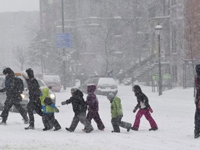 Children from a daycare centre cross a street during a winter storm in Montreal on February 2, 2011. When it comes to affordable daycare, Quebec's low-fee program is the envy of many a parent in other parts of Canada. Under the much-vaunted but polarizing program introduced in 1997, the bulk of Quebec parents pay but a fraction of the astronomical amounts their counterparts shell out elsewhere. Some pundits argue the Quebec model is too costly and fails to deliver, but others say the benefits of getting more women into the workforce and improving work-life balance help offset the annual $2.5 billion investment. But how exportable is the made-in-Quebec solution?
