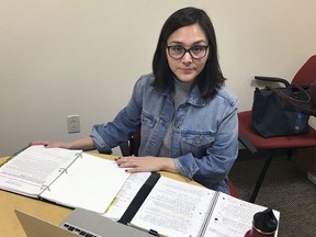 In this May 3, 2018 photo, Denia Perez, a student at Quinnipiac University School of Law, poses for a photo on the school's North Haven, Conn., campus. Connecticut's Judicial Branch is in the process of changing its rules to allow law students who don't have legal residency in the U.S to become practicing lawyers in the state. Perez, who was brought illegally to the United States from Mexico when she was 11 months old and who graduated this month, proposed the change.