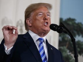 President Donald Trump delivers a statement on the Iran nuclear deal from the Diplomatic Reception Room of the White House, Tuesday, May 8, 2018, in Washington.