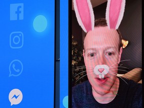 Facebook CEO Mark Zuckerberg is seen with digital bunny ears on-screen.