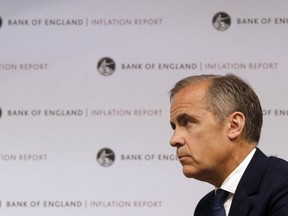 Mark Carney, Governor of the Bank of England, addresses the media during the quarterly Inflation Report press conference in London, Thursday, May 10, 2018.  Carney said the Bank of England has pulled back from a predicted rate hike, blaming some weaker than expected growth and inflation data.