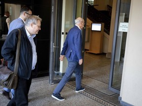 Daimler CEO Dieter Zetsche walks into the German transport ministry in Berlin Monday, May 28, 2018 where he had be summoned by German transportation Minister Andreas Scheuer after German authorities ruled that the Mercedes-Benz Vito delivery van's diesel emissions controls do not meet legal requirements.