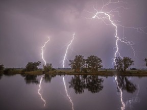In this May 27, 2018 photo thunderbolts are reflected near Premnitz, eastern Germany.