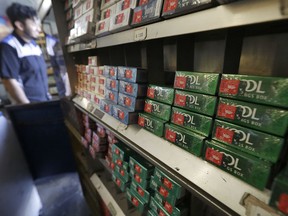 This May 17, 2018 photo shows packs of Kool menthol cigarettes displayed with other tobacco products at Ted's Market in San Francisco. R.J. Reynolds Tobacco Co. is pumping millions of dollars into a campaign to persuade San Francisco voters to reject a ban on selling on flavored tobacco products, including menthol cigarettes and vaping liquids with flavors like cotton candy, mango and cool cucumber.