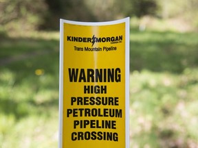 A sign where buried pipelines are located is seen in Burnaby B.C., just outside the Kinder Morgan location Thursday, April 26, 2018.