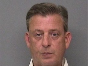This undated booking photo provided by the Redding Police Department shows Jonathan McConkey who is a general manager at IASCO Flight Training in Redding, Calif. McConkey and an assistant were arrested on suspicion of kidnapping a student pilot and trying to send him back to his native China, authorities said. (Redding Police Department via AP)