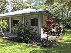 This October 2017 photo shows the home of Patricia Deter in Leilani Estates near the town of Pahoa on the island of Hawaii. Deter owned her Hawaii home for about a month before lava from a volcano eruption burned it down. Now her daughters are scrambling to sort out what the 88-year-old's homeowner insurance will cover. Officials say multiple homes have been destroyed after lava from Kilauea volcano oozed out of cracks in the Leilani Estates subdivision. Few insurance companies will write policies for that area.