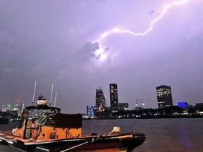 This photo made available by RNLI, shows a lightning strike during a storm in London, Saturday May 27, 2018. British meteorologists say up to 20,000 lightning strikes hit the U.K. during a powerful overnight thunderstorm, and a London-area airport is reporting flight disruptions after an aircraft refueling system was damaged.