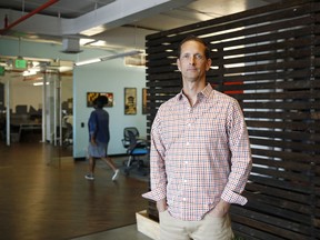 In this May 8, 2018 photo, Justin Shelby, CEO of Artichoke, a company that sells an app to help business owners manage their companies, poses for a photograph in Baltimore.