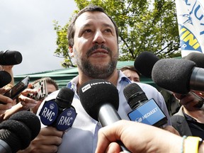 FILE - In this Saturday, May 19, 2018 file photo, the League party leader, Matteo Salvini, meets reporters in Milan, Italy. One of Italy's two main populist leaders says he and his rival have finally agreed on who should be premier, and it's neither of them. Exactly 11 weeks after elections resulted in political gridlock, League leader Matteo Salvini told reporters Sunday he and 5-Star Movement leader Luigi Di Maio have snagged a deal on both who should head Italy's next government and choice of Cabinet ministers.