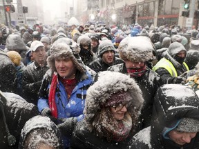 FILE - In this Feb. 23, 2018, file photo, fans attend a festival leading up to Super Bowl LII in downtown Minneapolis. Frigid Super Bowl LII brought $370 million in net new spending to the "Bold North" Twin Cities area, according to a report released Tuesday, May 29, 2018, by Gov. Mark Dayton's office and the local host committee.