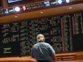 In this Monday, May 14, 2018 photo, betting odds are displayed on a board in the sports book at the South Point hotel and casino in Las Vegas. Now that the U.S. Supreme Court has cleared the way for states to legalize sports betting, the race is on to see who will referee the multi-billion-dollar business expected to emerge from the decision.