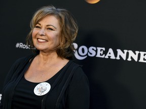 FILE - In this March 23, 2018, file photo, Roseanne Barr arrives at the Los Angeles premiere of "Roseanne" on Friday in Burbank, Calif.  Barr has apologized for suggesting that former White House adviser Valerie Jarrett is a product of the Muslim Brotherhood and the "Planet of the Apes." Barr on Tuesday, May 29, tweeted that she was sorry to Jarrett "for making a bad joke about her politics and her looks." Jarrett, who is African-American, advised Barack and Michelle Obama.