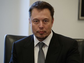 FILE - In this Dec. 14, 2016, file photo, Tesla CEO Elon Musk listens as President-elect Donald Trump speaks during a meeting with technology industry leaders at Trump Tower in New York.   Musk, who's been known for his quirky behavior, came under scrutiny after the conference call for Tesla's quarterly earnings Wednesday, May 2, 2018 went awry.  He was criticized for cutting off two analysts that asked about the electric vehicle and solar panel company's cash needs and orders for its Model-3. Musk called the questions "dry" and "not cool."