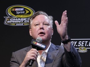FILE - In this Nov. 20, 2016, file photo, NASCAR CEO and Chairman, Brian France, talks to reporters during a news conference before a NASCAR Sprint Cup auto race practice in Homestead, Fla. NASCAR President Brent Dewar has told employees the France family "remains dedicated to the long term growth of our sport." The memo was sent to employees on Tuesday, May 8, 2018, one day after a media report said the France family was exploring the sale of its stake in the nation's top auto racing series.