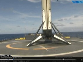 This image made available by SpaceX shows the company's Falcon 9 rocket booster after it landed on a drone ship in the Atlantic Ocean on Friday, May 11, 2018. Bangladesh's first satellite was lifted into orbit in the mission. (SpaceX via AP)