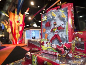 FILE - In this July 8, 2015, file photo, a Power Rangers figure sits on display at a booth before Preview Night at Comic-Con International held at the San Diego Convention Center in San Diego. Hasbro is buying the Power Rangers and some other toy brands from Saban Properties in a cash-and-stock deal valued at about $522 million.