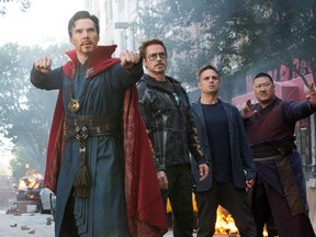 FILE - This image released by Marvel Studios shows, from left, Benedict Cumberbatch, Robert Downey Jr., Mark Ruffalo and Benedict Wong in a scene from "Avengers: Infinity War." Fox's "Deadpool 2" brought in $125 million according to studio estimates Sunday, May 20, 2018, and ended the three-week reign of Disney's "Avengers: Infinity War" at the top of the North American box office.