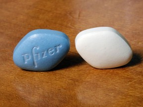 FILE- This Dec. 4, 2017, file photo shows a tablet of Pfizer's Viagra, left, and the company's generic version, sildenafil citrate, at Pfizer Inc., headquarters in New York. Pfizer Inc. reports earnings Tuesday, May 1, 2018.
