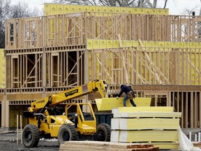 FILE- In this Feb. 26, 2018, file photo, work continues on a new development in Fair Lawn, N.J. On Tuesday, May 15, the National Association of Home Builders/Wells Fargo releases its May index of builder sentiment.