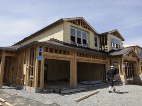 FILE- This May 4, 2018, file photo shows a house is under construction in Roseville, Calif. On Wednesday, May 23, the Commerce Department reports on sales of new homes in April.