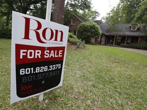 FILE- In this April 23, 2018, file photo a for sale sign sits in front of a home in Jackson, Miss. On Thursday, May 24, Freddie Mac reports on the week's average U.S. mortgage rates.
