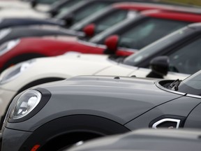 FILE- In this May 7, 2018, file photo, a long line of 2018 and 2019 Cooper Countryman models sits at a Mini Cooper dealership in Highlands Ranch, Colo. On Thursday, May 31, the Commerce Department issues its April report on consumer spending, which accounts for roughly 70 percent of U.S. economic activity.