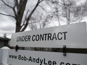 In this Wednesday, March 28, 2018, photo an "under contract" sign is shown outside a single-family home on the market in Denver. On Thursday, May 31, 2018, the National Association of Realtors releases its April report on pending home sales, which are seen as a barometer of future purchases.