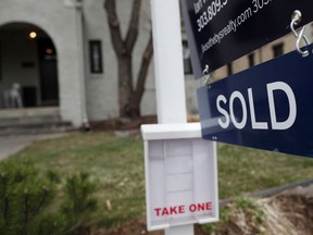 In this Wednesday, March 28, 2018, photo, a sold sign is shown outside a single-family home on the market in Denver. On Thursday, May 31, Freddie Mac reports on this week's average U.S. mortgage rates.