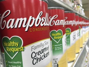 FILE- In this May 23, 2017, file photo, Campbell's soups on display at a local supermarket in Orlando, Fla. The Campbell Soup Company reports earnings Friday, May 19, 2018.
