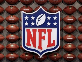 FILE - In this Nov. 30, 2017, file photo, an NFL logo is displayed at the opening of "NFL Experience" in Times Square, New York. Now that the U.S. Supreme Court has cleared the way for states to legalize sports betting, the race is on to see who will referee the multi-billion-dollar business expected to emerge from the decision. Hours after the court ruled on Monday, May 14, 2018, the NFL called time-out and asked for an official review. The league called on Congress to "enact a core regulatory framework for legalized sports betting."