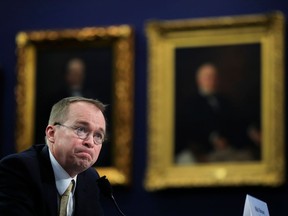 FILE- In this April 18, 2018, file photo, Office of Management and Budget Director Mick Mulvaney testifies before a House Appropriations Committee hearing on Capitol Hill in Washington. The Trump administration is signaling that it intends to pull back on investigating potential abuses by companies in the $1.5 trillion student loan market. The Consumer Financial Protection Bureau is shuttering its student lending office, according to an announcement Wednesday, May 9, 2018, by its acting director, Mick Mulvaney. Its responsibilities are being moved under the broad umbrella of "financial education."