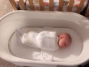 This Jan. 3, 2017 photo released by Paul Zalewski shows his infant daughter Ruby in a smart-tech sleeper called the Snoo, which gently rocks and jiggles babies to sleep from birth to 6 months old.