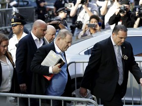 Harvey Weinstein arrives at the first precinct while turning himself to authorities following allegations of sexual misconduct, Friday, May 25, 2018, in New York.