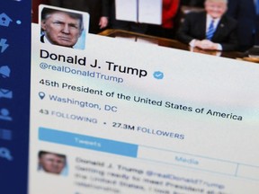 FILE - This April 3, 2017, file photo shows U.S. President Donald Trump's Twitter feed on a computer screen in Washington.  President Donald Trump violates the U.S. Constitution's First Amendment when he blocks critics on Twitter for political speech, a judge ruled Wednesday, May 23, 2018.