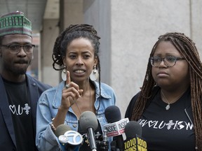 Donisha Prendergast, center, is joined by Kelly Fyffe Marshall, right, and Komi-Oluwa Olafimihan as she speaks during a news conference, Thursday, May 10, 2018, in New York. Prendergast, the granddaughter of Bob Marley, and her two friends say they want police held accountable as well as a neighbor who called 911 to report a burglary when they were leaving a California rental home.