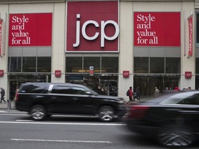 In this Wednesday, May 16, 2018, photo, traffic makes it's past the JC Penney logo hanging outside the Manhattan mall in New York.