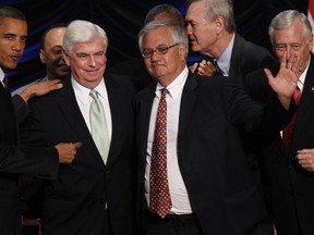 FILE - In this July 21, 2010 file photo, President Barack Obama, left, stands with Sen. Chris Dodd, D-Conn., second left, Rep. Barney Frank, D-Mass., second right, and Rep. Steny Hoyer, D-Md., after he signed the Dodd-Frank Wall Street Reform and Consumer Protection financial reform bill at the Ronald Reagan at the Ronald Reagan Building in Washington. Congress has voted to roll back some key elements of the Dodd-Frank law, which was enacted to provide the kind of regulatory framework that might keep another Great Recession from happening. Supporters of a vote, Tuesday, May 22, 2018 say it will spur the economy by increasing lending, easing the regulatory burden on small and medium-sized banks. Critics argue that it increases the chances of future taxpayer bailouts like the ones that followed the financial crisis.