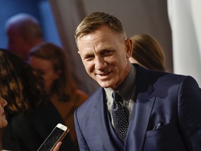 FILE - In this Monday, April 9, 2018, file photo, actor Daniel Craig attends The Opportunity Network's 11th Annual Night of Opportunity Gala at Cipriani Wall Street in New York. After more than a decade at Sony Pictures, James Bond has a few new homes. In a joint announcement with their new partners Thursday, May 24, 2018, Michael G. Wilson and Barbara Broccoli said Universal Pictures will release the 25th installment of the superspy franchise internationally while MGM will release the film in the U.S. Craig will be reprising his role as 007 in the film and Oscar-winner Danny Boyle will direct.