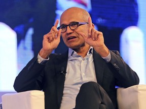 File-This Nov. 7, 2017, file photo shows Microsoft CEO Satya Nadella, speaking with former Indian cricketer, Anil Kumble, during their conversation about Satya's book, "Hit Refresh" at an event in New Delhi, India.  Microsoft's annual Build conference for software development kicks off on Monday, May 7, 2018, giving the company an opportunity to make announcements about its computing platforms or services. The three-day event features sessions on cloud computing, artificial intelligence, internet-connected devices and virtual reality. Nadella will speak to more than 6,000 people who've registered to attend. Most are developers who build apps for Microsoft's products.