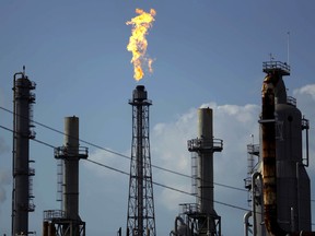 A flame burns at the Shell Deer Park oil refinery in Deer Park, Texas. Oil prices hit US$80 a barrel on Thursday for the first time since November 2014.
