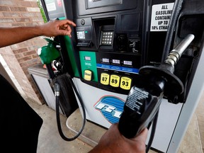 A driver fills up at a gas station in Richland, Miss. Crude oil prices are at the highest level in more than three years and expected to climb higher, pushing up gasoline prices along the way.
